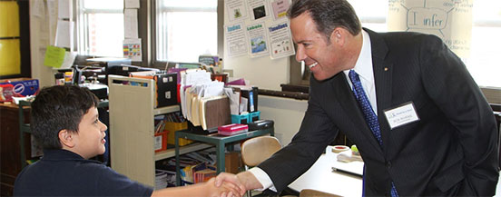 CEO Bob Rivers shaking students hand