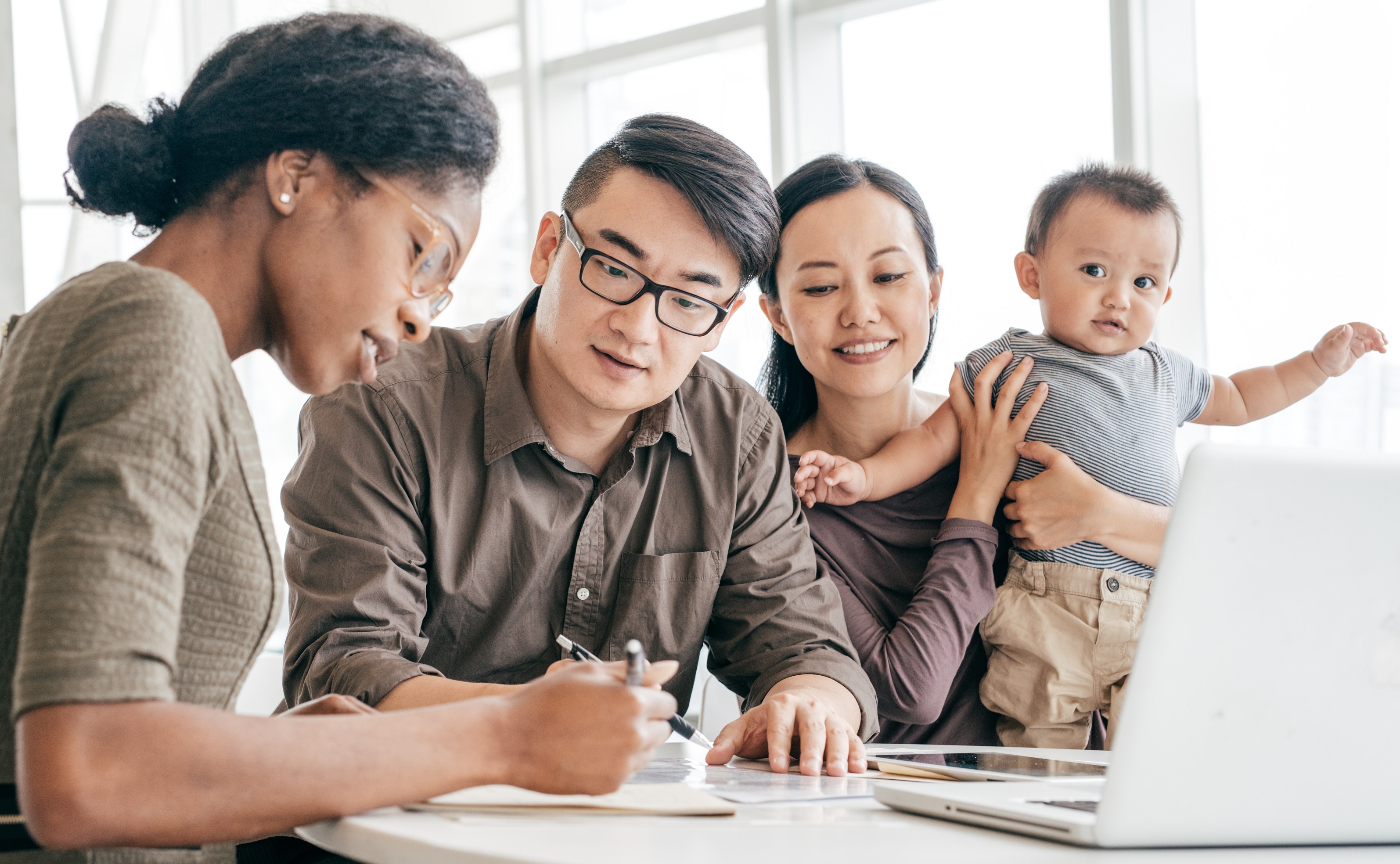 A couple works with their real estate agent to find a home