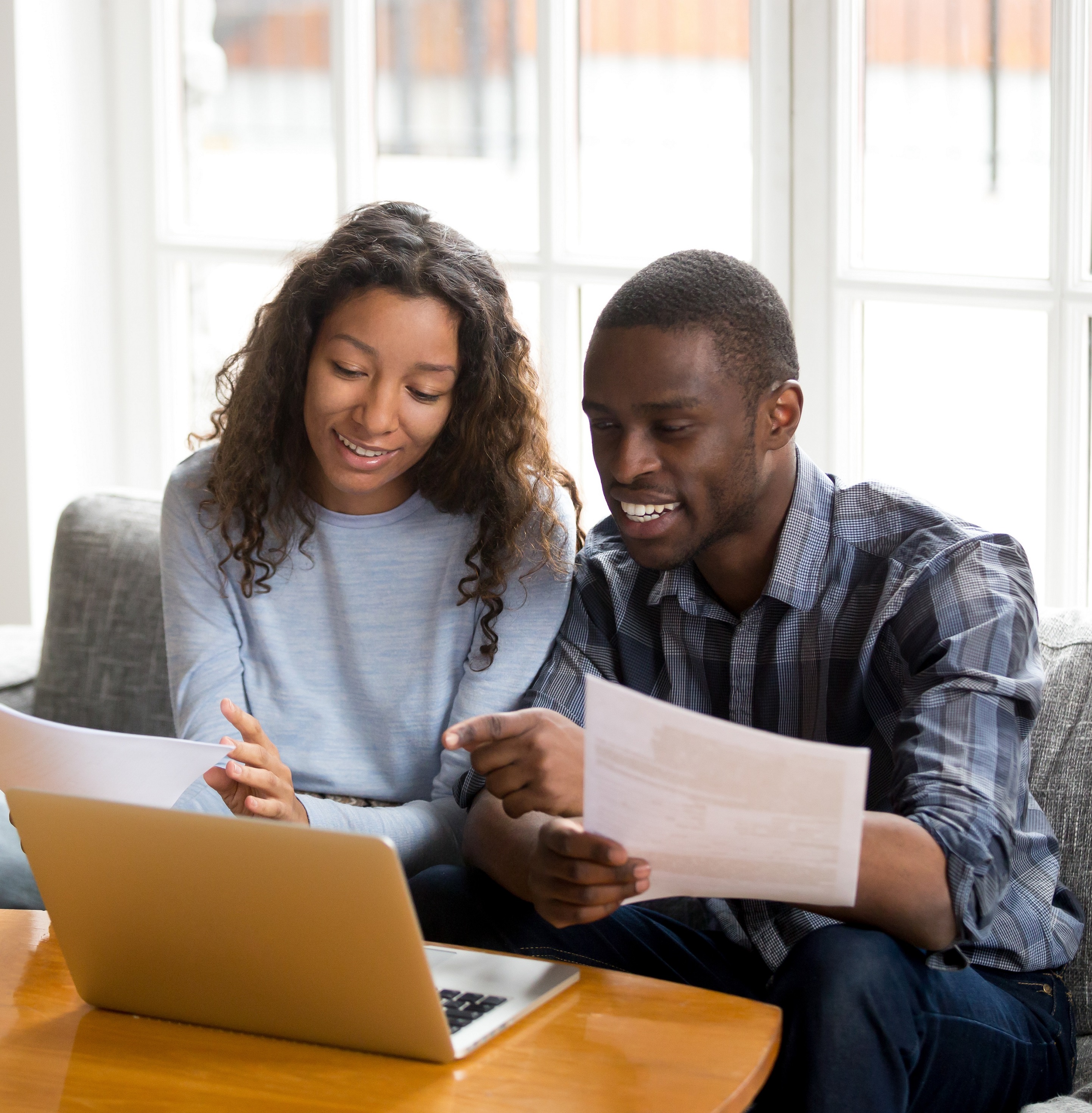 A couple begins the refinance process 