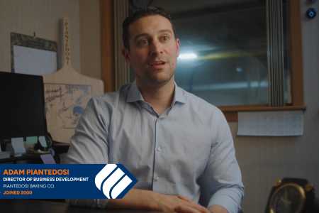 Adam Piantedosi, the Director of Business Development for Piantedosi Bakery, sits at his desk and speaks about working with Eastern Bank