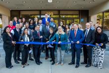 Members of the Eastern Bank Foundation stand with members of the City of Lynn in front of 195 Market St