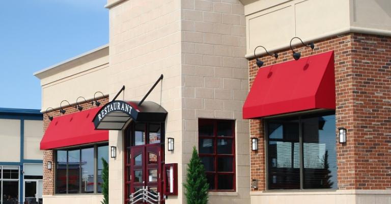 View of the outside of a franchise restaurant in a shopping plaza