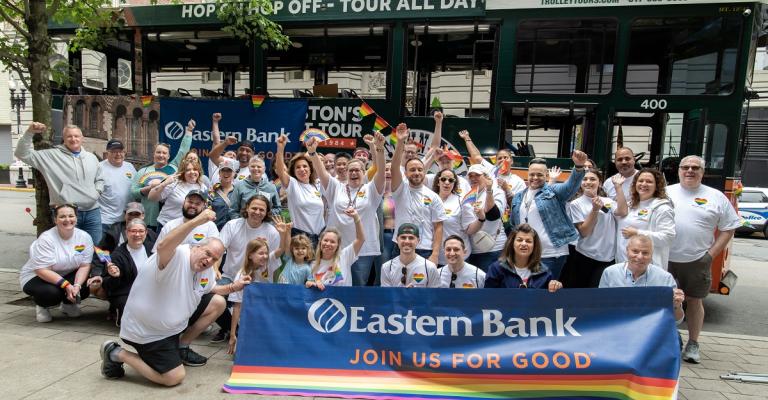 Eastern Bank employees gather for a celebratory picture at the Boston Pride Parade
