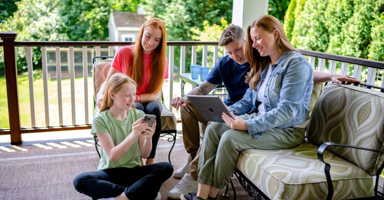 A family sits together and reviews Eastern Bank's saving options