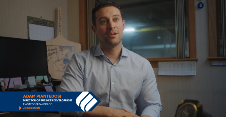 Adam Piantedosi, the Director of Business Development for Piantedosi Bakery, sits at his desk and speaks about working with Eastern Bank